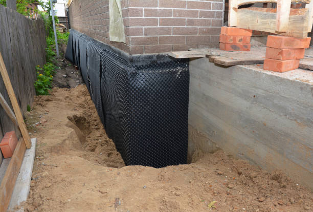 Happy homeowners after waterproofing job in Bellmawr
